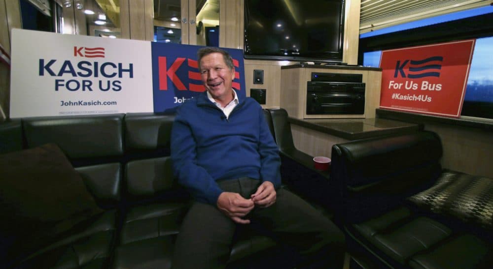 In this photo taken Jan. 20, 2016, Republican presidential candidate, Ohio Gov. John Kasich smiles as he answers a question during an interview on his campaign bus in Bow, N.H. (Charles Krupa/AP)