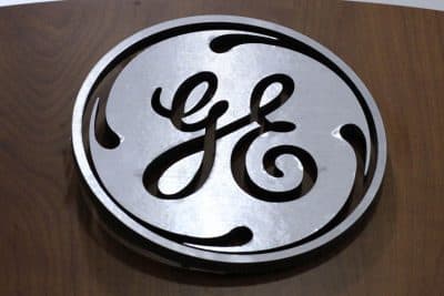 FILE - This Jan. 16, 2014 file photo shows the General Electric logo at a store in Cranberry Township, Pa. General Electric announced Wednesday, Jan. 13, 2016, it will move its headquarters from Fairfield, Conn., to the Seaport District of Boston. (AP Photo/Gene J. Puskar, File)