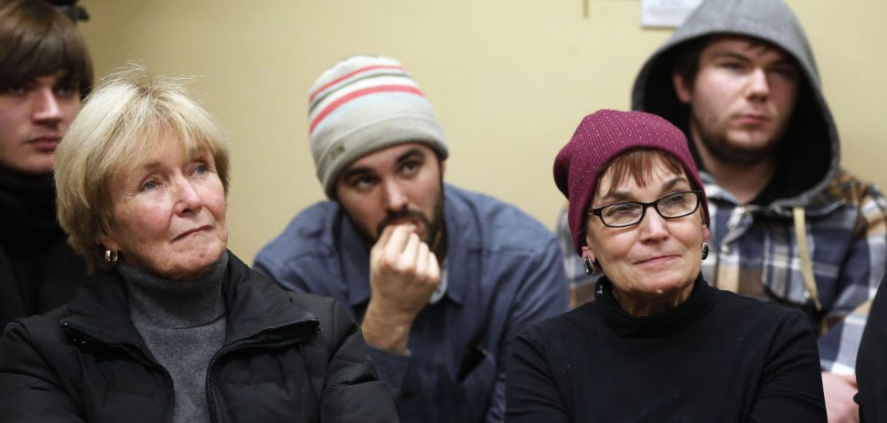 New Hampshire voters listen to Republican presidential candidate, Ohio Gov. John Kasich at a Conway, N.H. public library on Friday. (Jim Cole/AP)