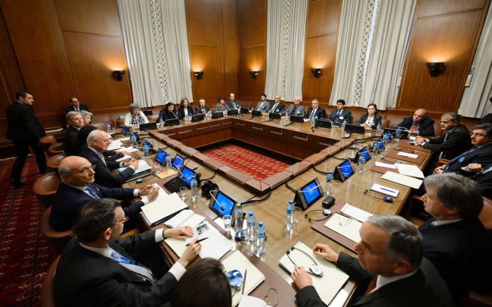 United Nations special envoy Staffan de Mistura (center left) sits facing Syria's main opposition group during Syrian peace talks at the UN Offices in Geneva on February 1, 2016. (Fabrice Coffrini/AFP/Getty Images)
