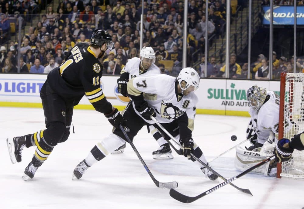 Pittsburgh Penguins goalie Marc-Andre Fleury (29) keeps the puck in front as Boston Bruins right wing Jimmy Hayes (11) tries to get position against Pittsburgh Penguins center Matt Cullen (7) during yesterday's game. Bruins won 5-1. (Elise Amendola/AP)