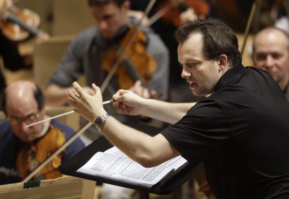 In this 2014 file photo, Boston Symphony Orchestra music director Andris Nelsons rehearses at Symphony Hall. The BSO won the orchestral performance Grammy for "Shostakovich Under Stalin's Shadow," on Monday. It was the orchestra's first recording in a new partnership with the Deutsche Grammophon label, and its seventh Grammy overall. (Steven Senne/AP)