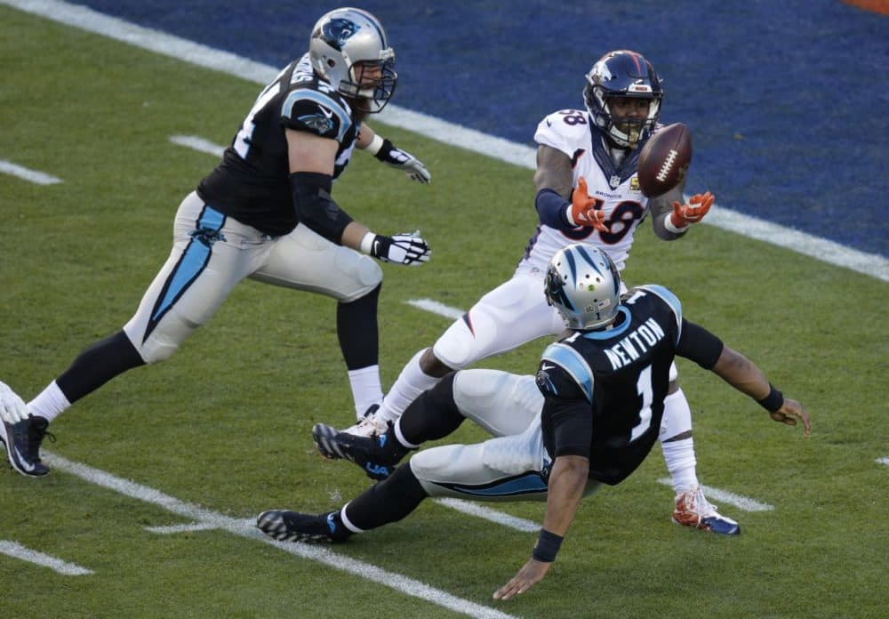 Broncos' Von Miller -- the Super Bowl MVP -- strips the ball from Panthers' QB Cam Newton (1) during the first half of the NFL Super Bowl on Sunday. (Charlie Riedel/AP)