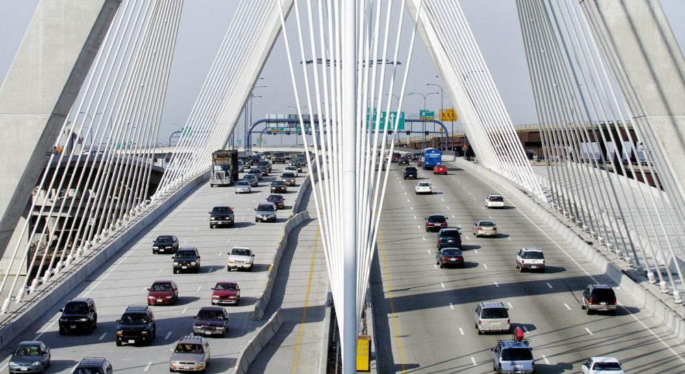 Thomas J. Fitzgerald: "Massachusetts had a net loss in domestic migration of 21,805 residents from July 2014 to July 2015, roughly the equivalent of losing the town of Winchester."
Pictured: A stretch of Interstate 93 over the Leonard P. Zakim Bunker Hill Bridge in Boston. (Michael Dwyer/AP)