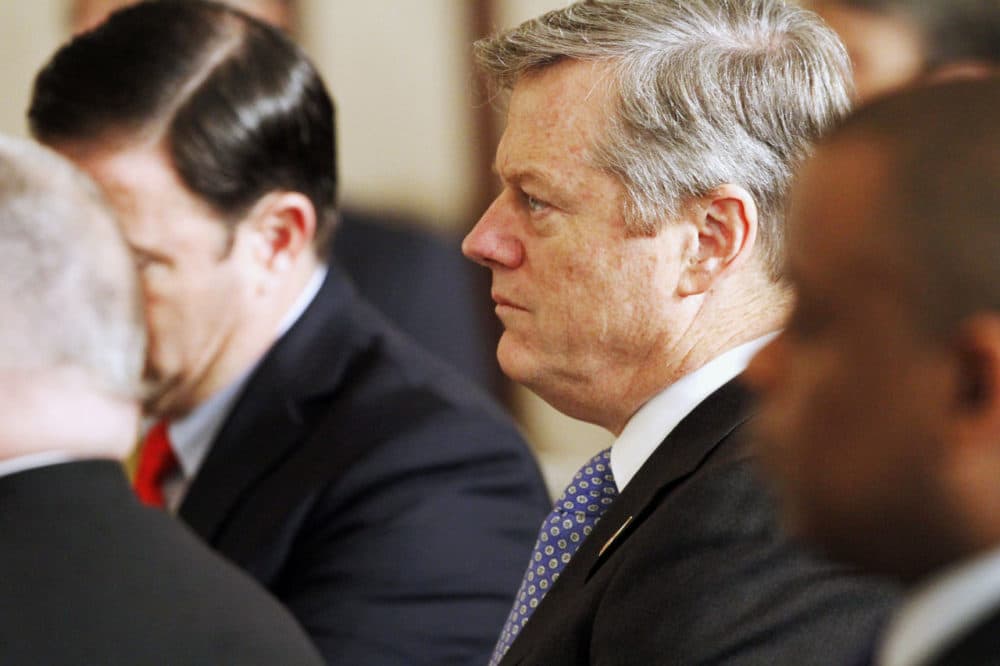 Massachusetts Gov. Charlie Baker listens as President Barack Obama speaks during a meeting with governors in the State Dining Room of the White House on Feb. 22. (Jacquelyn Martin/AP)