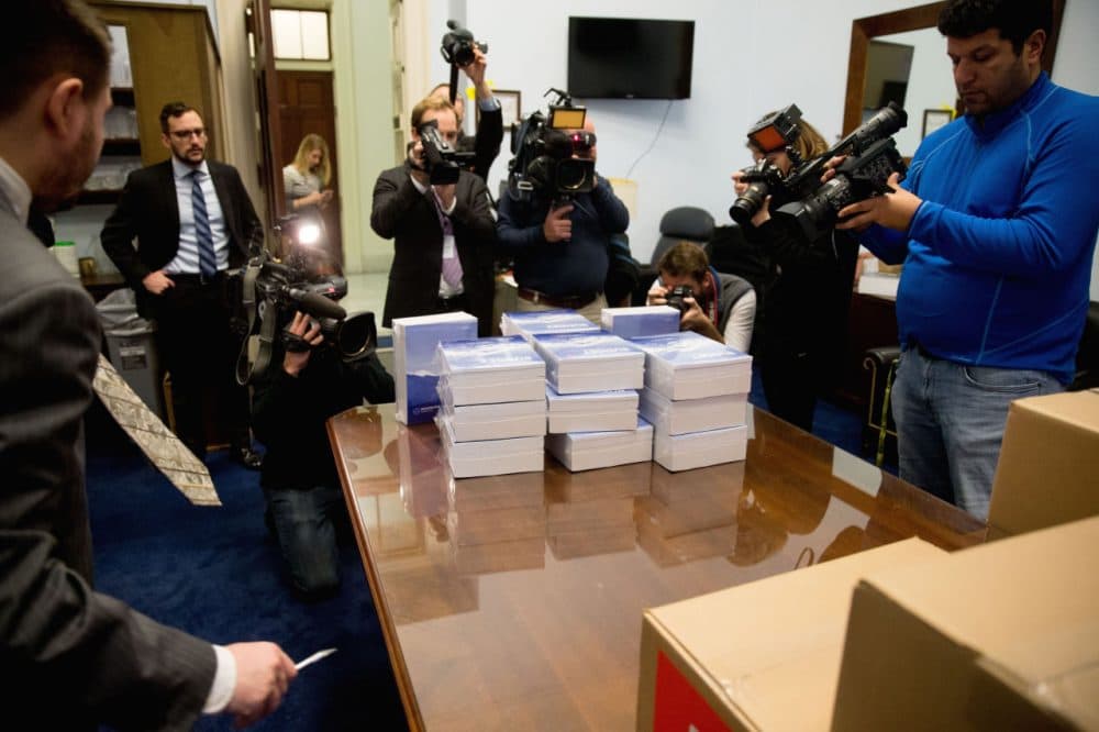 Members of the media surround copies of the President Obama's fiscal 2017 federal budget as they arrive on Capitol Hill last Tuesday. (AP Photo/Andrew Harnik)
