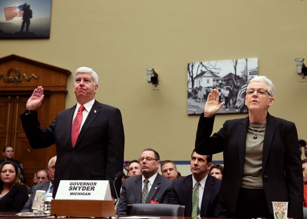 EPA Administrator Gina McCarthy, (R), and Gov. Rick Snyder, (R-MI), are sworn in during a House Oversight and Government Reform Committee hearing, about the Flint, Michigan water crisis, on Capitol Hill March 17, 2016 in Washington, DC. The committee is examining how lead ended up in the public drinking water in Flint, Michigan. (Mark Wilson/Getty Images)