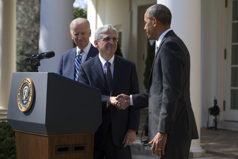 Garland, center, shakes hands with President Barack Obama, right, as Vice President Joe Biden watches during his introduction as Obamas nominee for the Supreme Court in the Rose Garden of the White House. (Evan Vucci/AP)