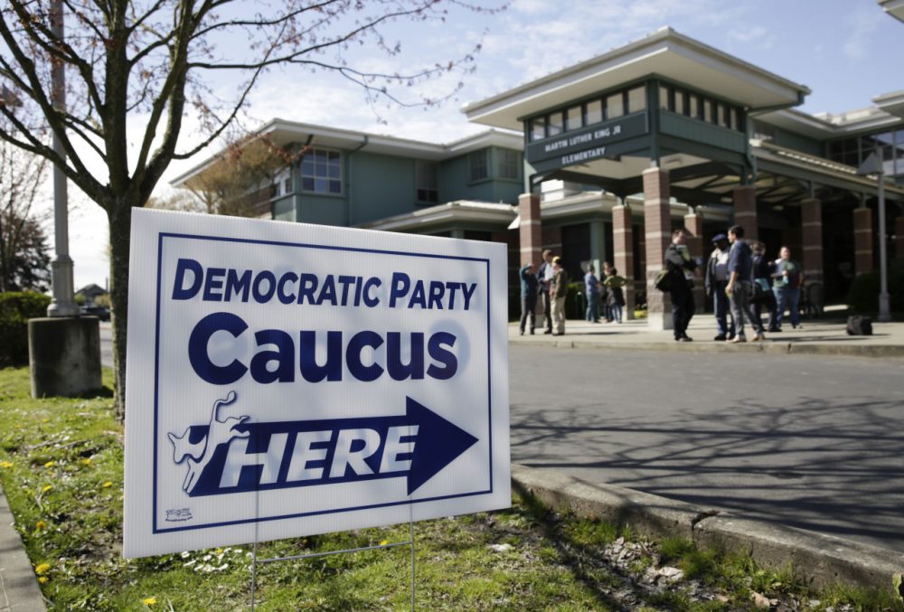 People take part in Washington state Democratic caucuses at Martin Luther King Elementary School in Seattle on March 26, 2016. (Jason Redmond/AFP/Getty Images)