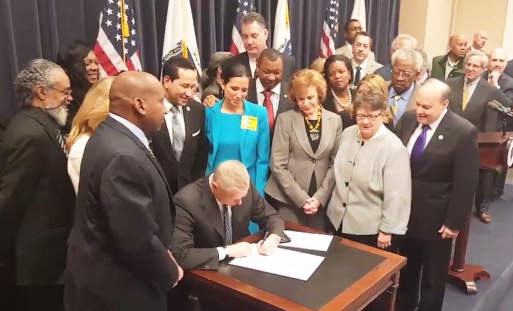 Gov. Charlie Baker signing a bill that would end the automatic suspension of a drug offender's driver's license. (@MassGovernor/Twitter)