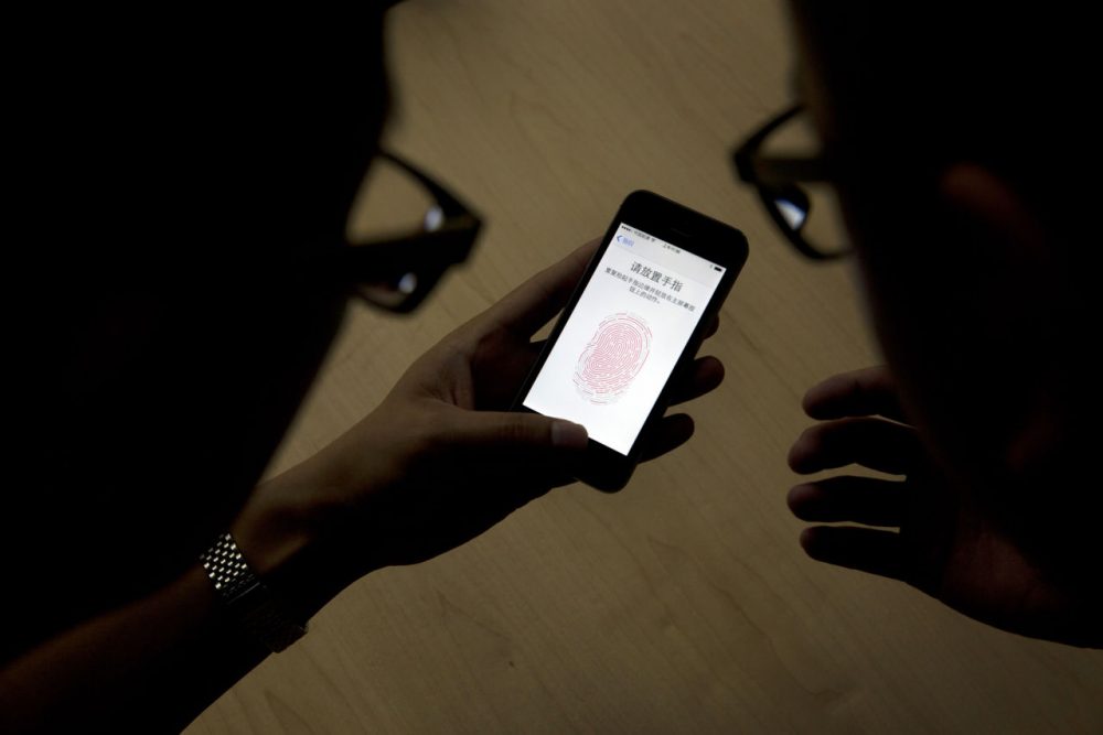 While the government has dropped its case against Apple regarding hacking the iPhone of one of the San Bernardino attackers, there are other similar cases still pending, including here in Boston. (Ng Han Guan/AP)