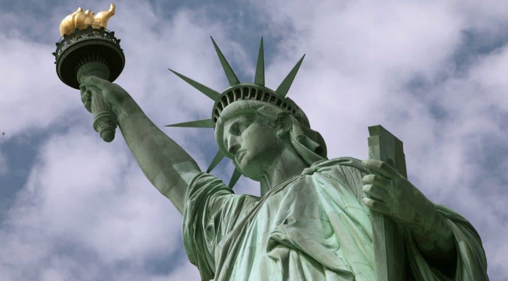 Eric Silverman: "Woeful as it is, xenophobia is a time-honored American tradition. But so is the ideal of a more hospitable message." Pictured:
The Statue of Liberty. (Richard Drew/AP)