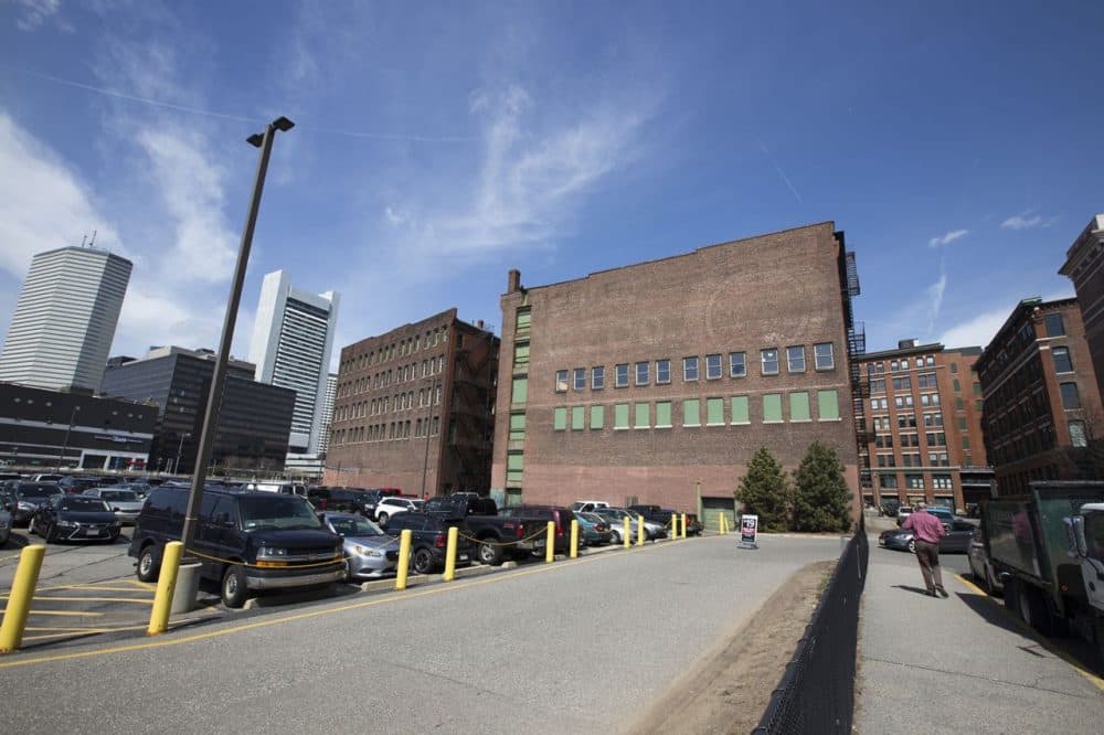 General Electric will move to a 2.5-acre site in Fort Point that includes two older brick buildings and a portion of a parking lot. (Joe Difazio for WBUR)