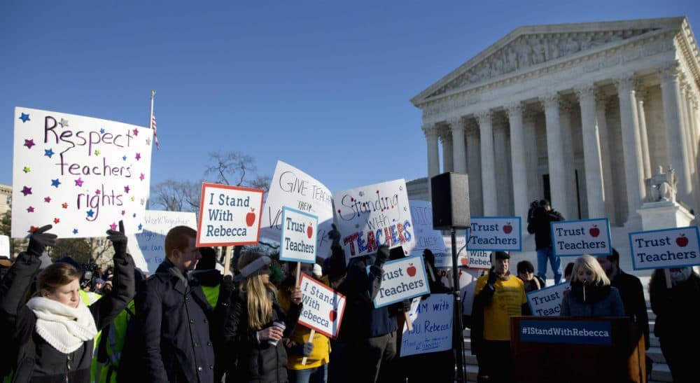 People participate in a rally at the Supreme Court in Washington, Monday, Jan. 11, 2016, as the court heard arguments in the 'Friedrichs v. California Teachers Association' case. (Jacquelyn Martin/AP)
