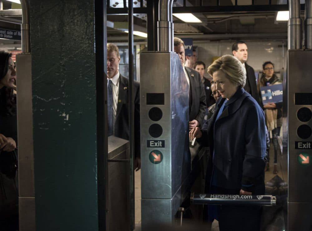 Democratic presidential candidate Hillary Clinton swipes a MetroCard to ride the No. 4 train as she campaigns on April 7, 2016 in the Bronx borough of New York City. The former U.S. secretary of state first spoke outside of Yankee Stadium before riding the subway from the 161st Street station to the 170th Street station. (Andrew Renneisen/Getty Images)