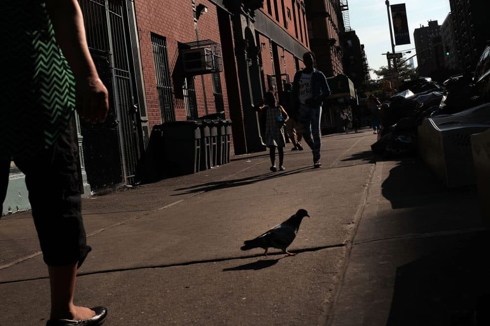 People walk in East Harlem on September 16, 2015 in New York City. (Spencer Platt/Getty Images)