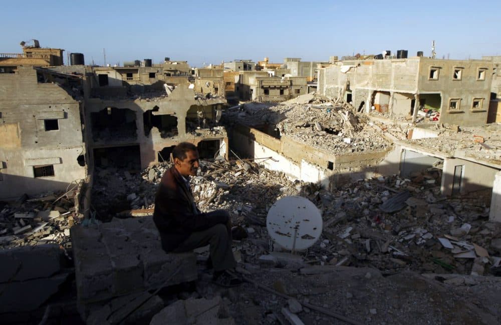 A Libyan man looks at destroyed building on March 4, 2016 in Laithi district, a central area that was recently re-seized by forces loyal to Libya's internationally recognized government in the eastern coastal city of Benghazi. (Abdullah Doma/AFP/Getty Images)