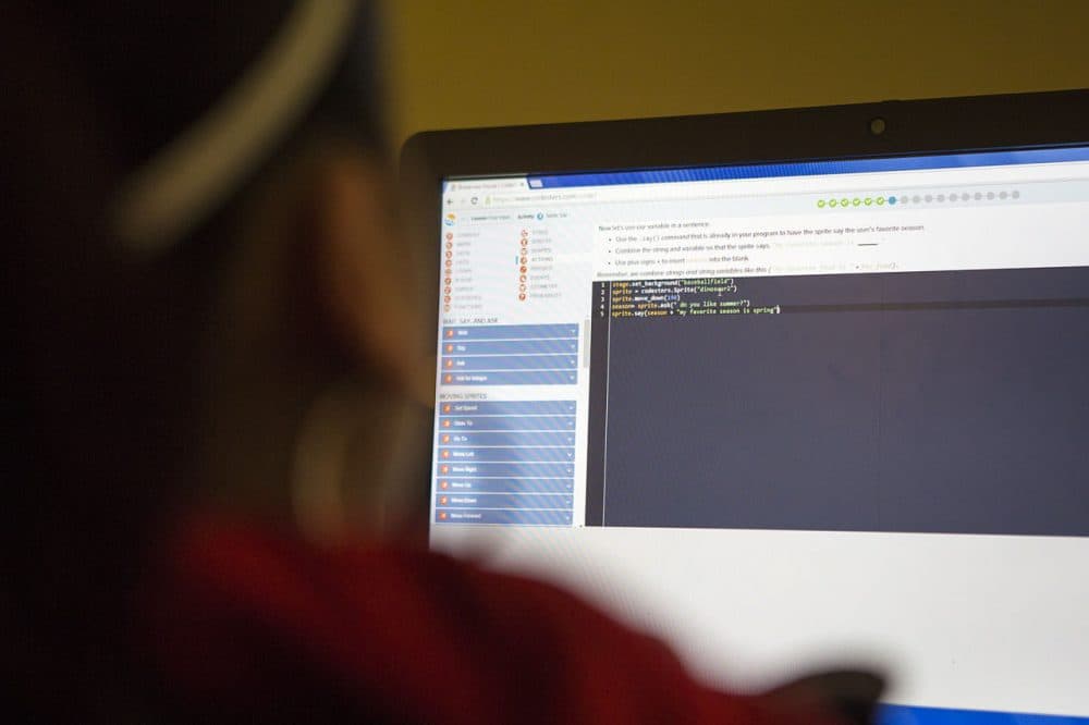Students in the Brookview Girls Who Code Club use Scratch, a simple language developed at MIT, to create computer programs. (Jesse Costa/WBUR)