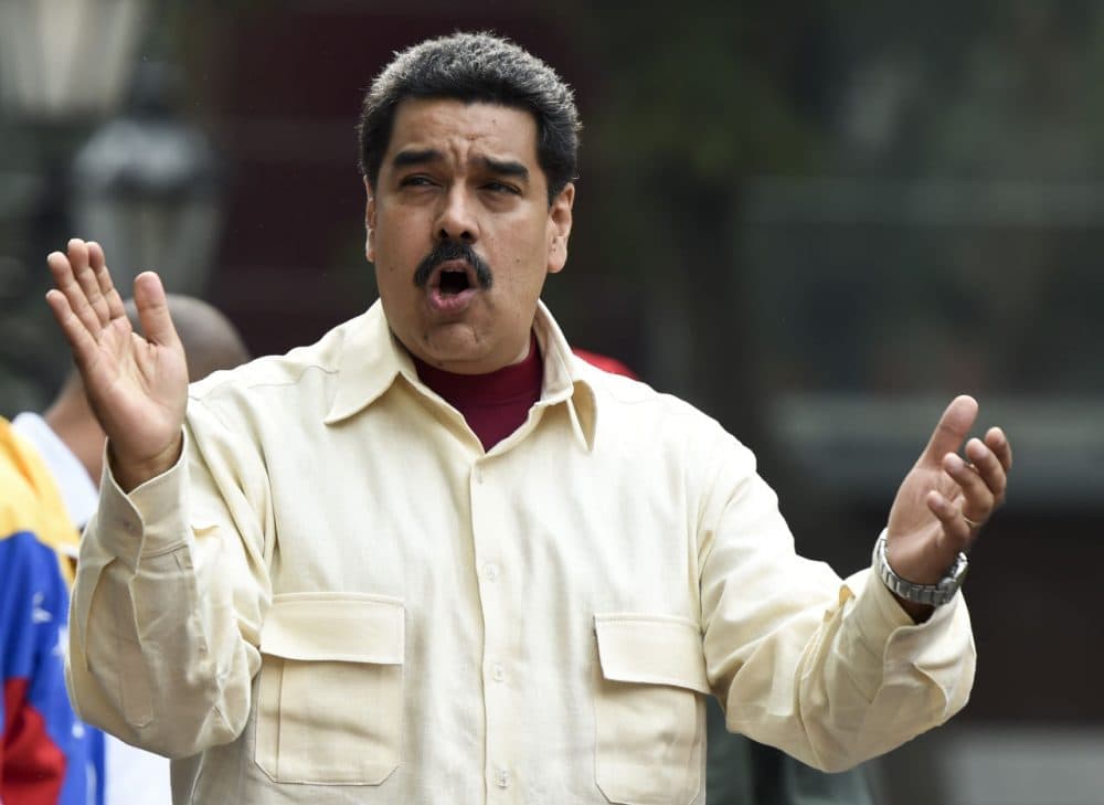 Venezuelan President Nicolas Maduro gestures at supoorters during a demonstration in Caracas on April 19, 2016.
Venezuelan President Nicolas Maduro's six-year term reaches midpoint on Tuesday, a date few have been anticipating more eagerly than the country's opposition, which will now be able to initiate a recall referendum. (Juan Barreto/AFP/Getty Images)