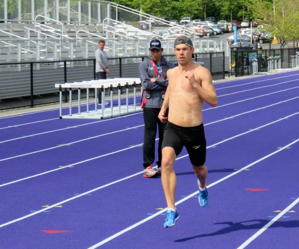 Olympic half-miler Nick Symmonds flies past his Brooks Beasts team coach Danny Mackey during training in Seattle. (Tom Banse/NWW)