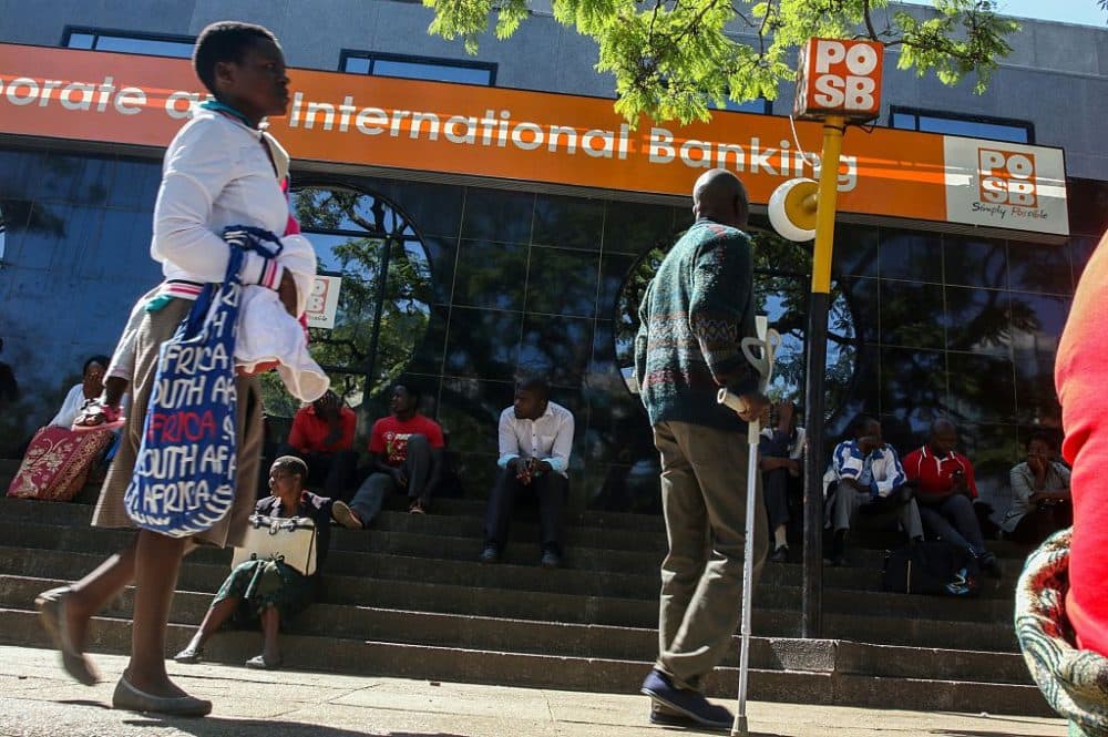Zimbabweans queue to withdraw cash outside a bank on May 5, 2016 in Harare, Zimbabwe.
Zimbabweans formed long queues outside banks Thursday after the government slapped new limits on cash withdrawals and announced that "bond notes" at par with the US dollar would be introduced. (JEKESAI NJIKIZANA/AFP/Getty Images)