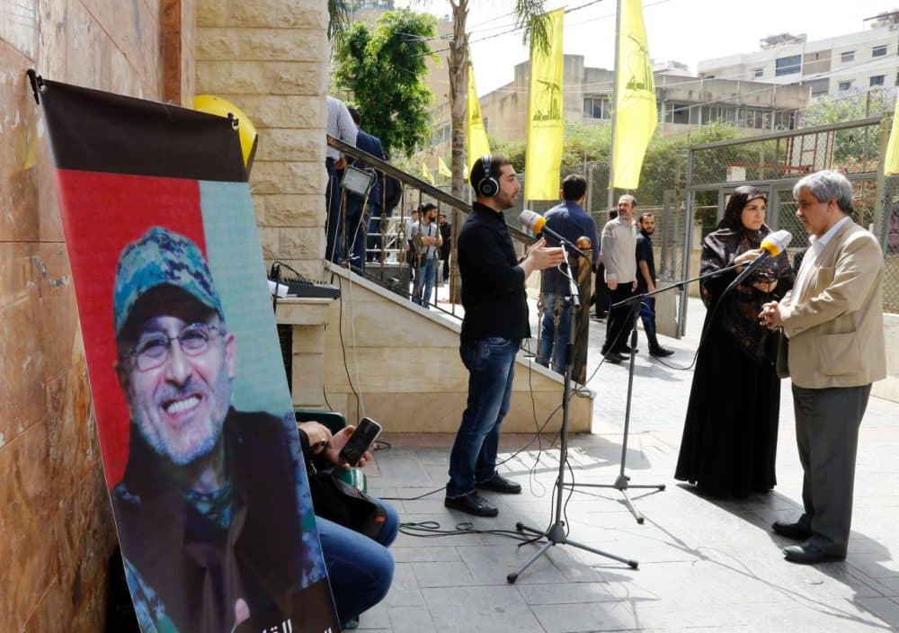 Lebanese press report from outside where family members are receiving condolences for the death of top Hezbollah commander Mustafa Badreddine who was killed in an attack in Syria in a southern suburb of Beirut on May 13, 2016.
Lebanese militant group Hezbollah announced that its top military commander had been killed in an attack in Syria in a major blow to the coalition supporting the Damascus regime.
(Anwar Amro/AFP/Getty Images)