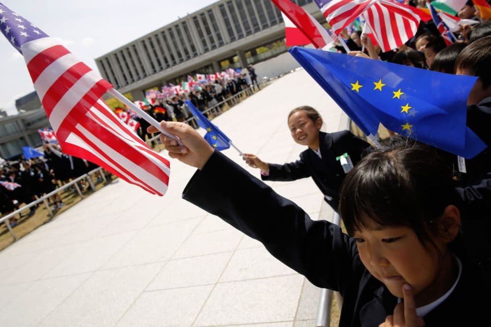 Children hold up flags from the G7 countries in the wind as the foreign ministers visit the Peace Memorial Park, on the sidelines of the G7 Foreign Ministers' Meeting in Hiroshima on April 11, 2016.
Kerry and other G7 foreign ministers made the landmark visit on April 11 to the memorial site for the world's first nuclear attack in Hiroshima.
(Jonathan Ernst/AFP/Getty Images)