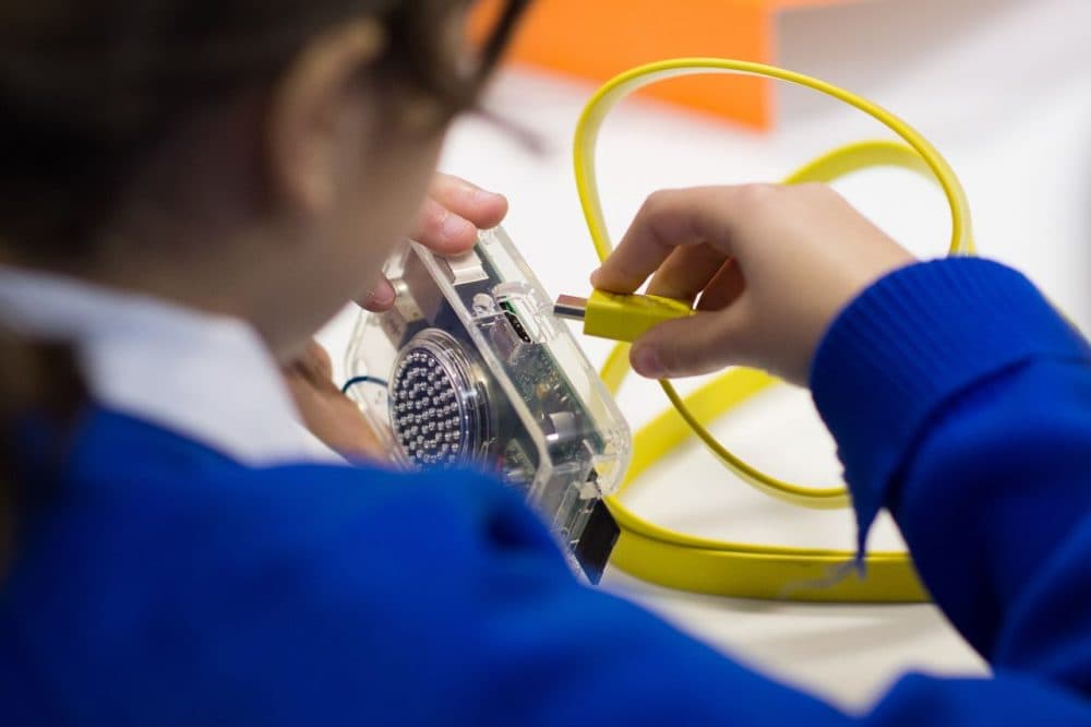 A school girl takes part in a "Kano Party" to construct working computers in central London on January 24, 2015. (Leon Neal/AFP/Getty Images)