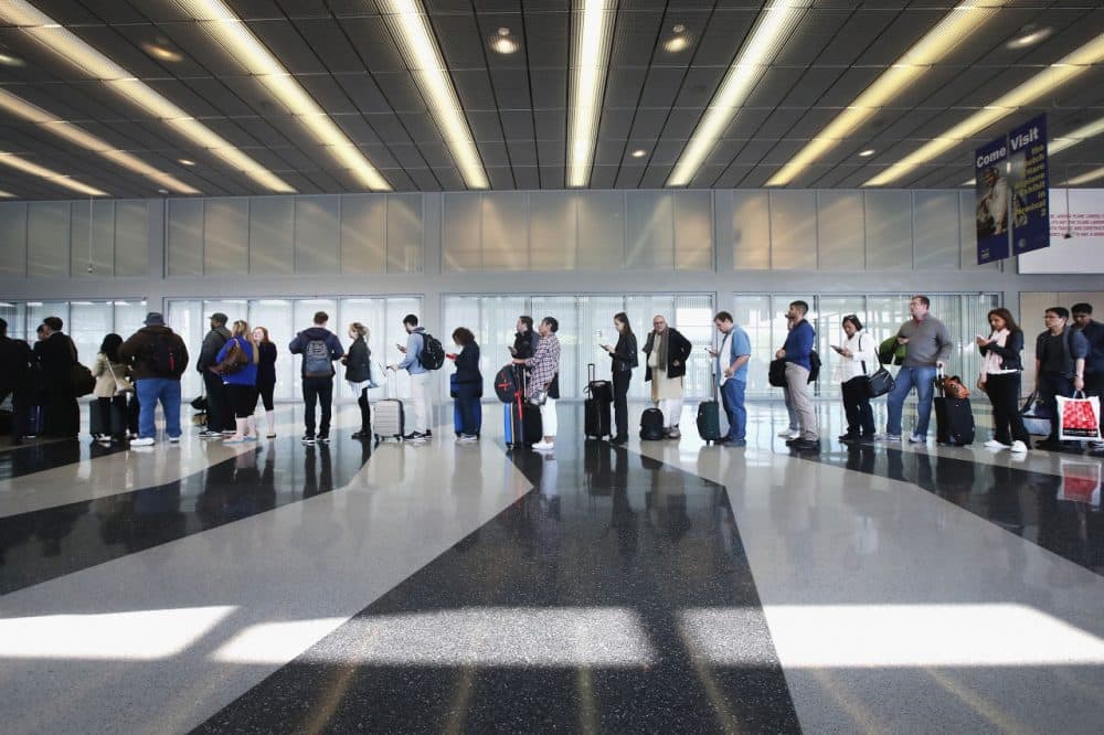 Passengers at O'Hare International Airport wait in line to be screened at a Transportation Security Administration (TSA) checkpoint on May 16, 2016 in Chicago, Illinois. Waiting times at the checkpoints today have been reported to be as long 2 hours. The long lines have been blamed for flight delays and a large number of passengers missing flights completely. (Scott Olson/Getty Images)