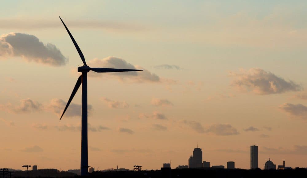 A wind turbine stands next to Hull High School in the shadow of Boston. (Stephen Savoia/AP File)
