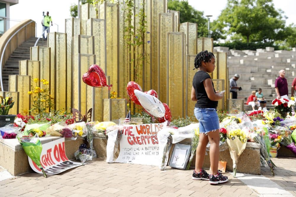 Mourners gather at a memorial following the death of boxing legend Muhammad Ali outside the Muhammad Ali Center June 4, 2016 in Louisville, Kentucky. Ali died at a Phoenix-area hospital, where he had spent the past few days being treated for respiratory complications. (Aaron P. Bernstein/Getty Images)