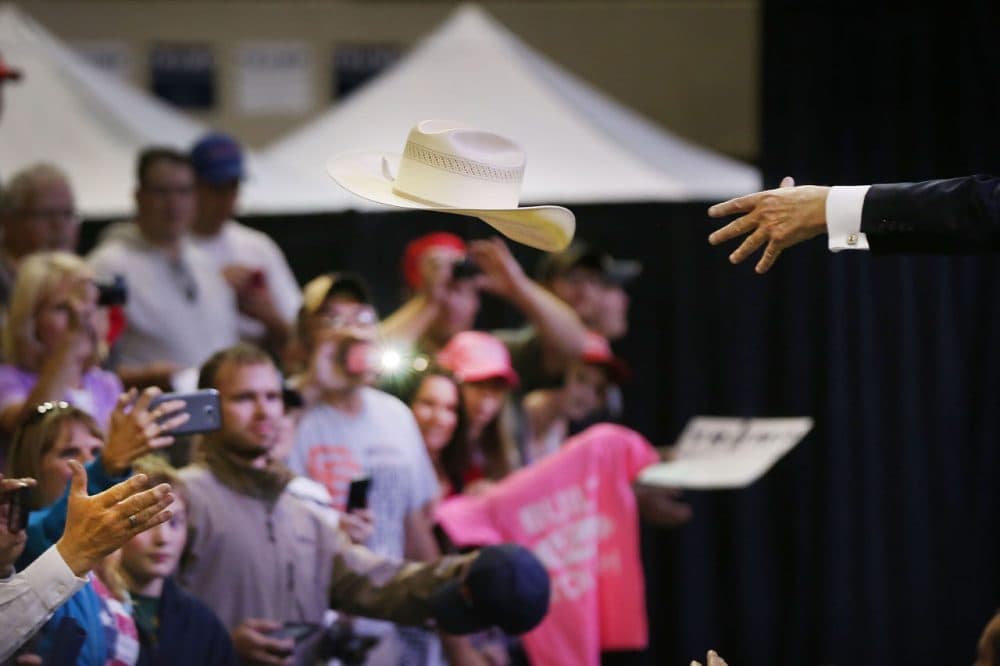 Republican presidential candidate Donald Trump throws a cowboy hat back to the crows as he signs autographs following a speech at a rally on May 26, 2016 in Billings, Montana. (Spencer Platt/Getty Images)