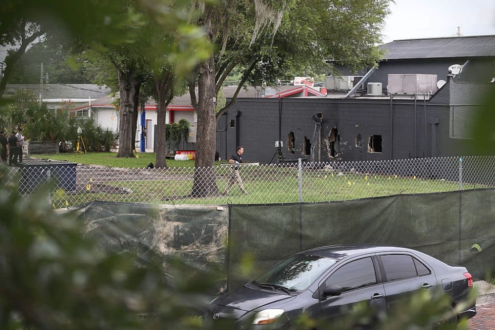 FBI agents investigate near the damaged rear wall of the Pulse Nightclub where Omar Mateen allegedly killed at least 50 people on June 12, 2016 in Orlando, Florida. The mass shooting killed at least 50 people and injuring 53 others in what is the deadliest mass shooting in the country's history. ( Joe Raedle/Getty Images)