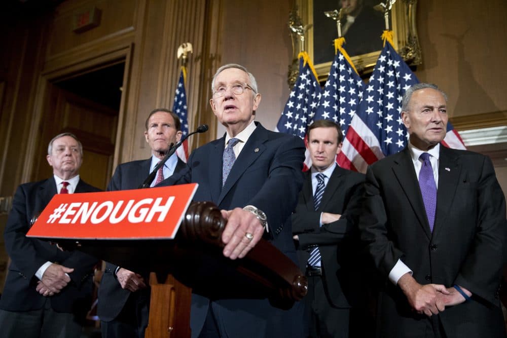 Sen. Richard Durbin, D-Ill., left, Sen. Richard Blumenthal, D-Conn., Sen. Chris Murphy, D-Conn., and Sen. Charles Schumer, D-N.Y., listen as Minority Leader Harry Reid of Nevada, center, speaks during a media availability, on Capitol Hill, Monday. (Alex Brandon/AP)