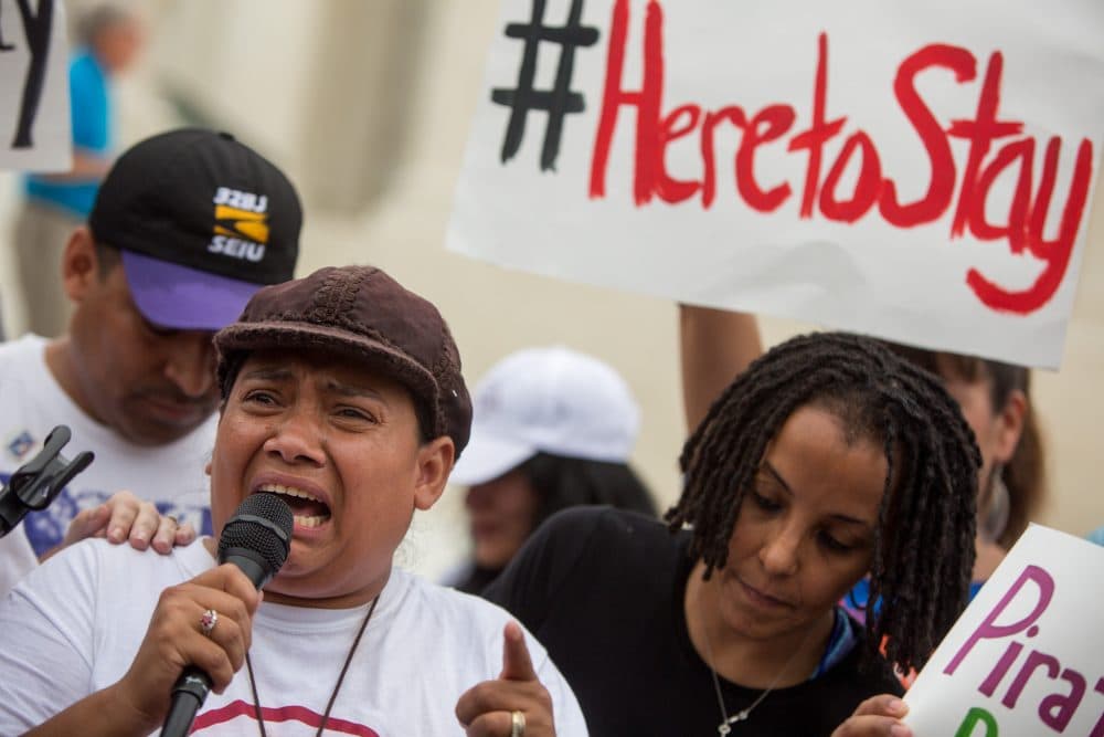 Rosario Reyes, an undocumented mother from El Salvador, reacts to news on a Supreme Court decision blocking Obama's immigration plan, which would have protected millions of immigrants from deportation, in front of the U.S. Supreme Court, on June 23, 2016 in Washington, DC. The court was divided 4-4, leaving in place an appeals court ruling blocking the plan. (Allison Shelley/Getty Images)