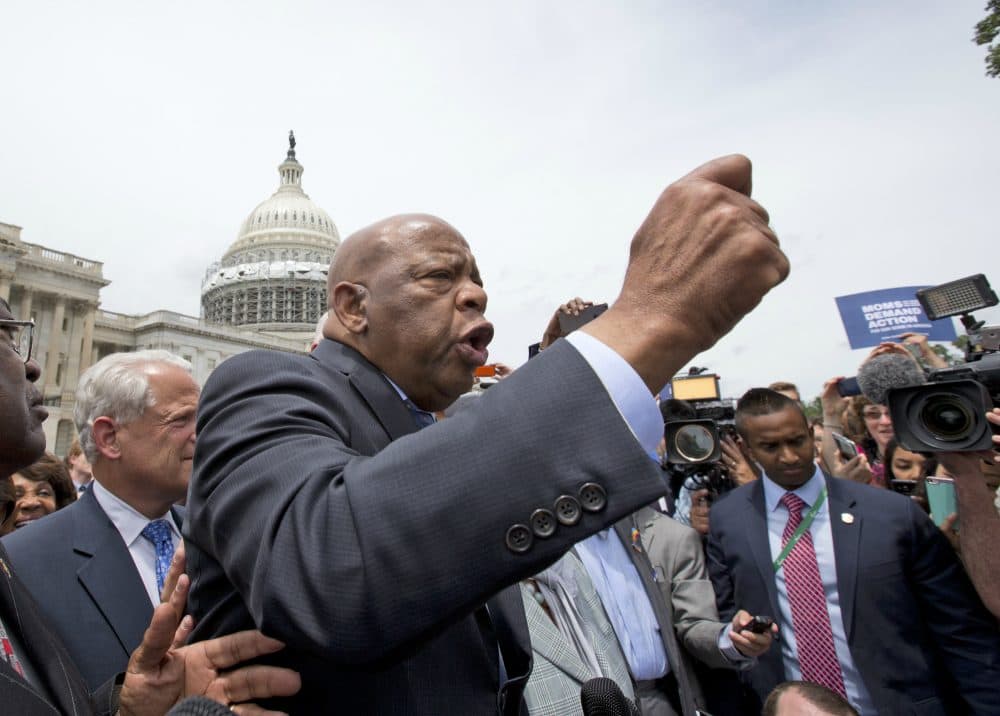 Rep. John Lewis, D-Ga., addresses the crowd after a "sit in," on the House floor, on Capitol Hill, Thursday, June 23, 2016 in Washington. (Alex Brandon/AP)