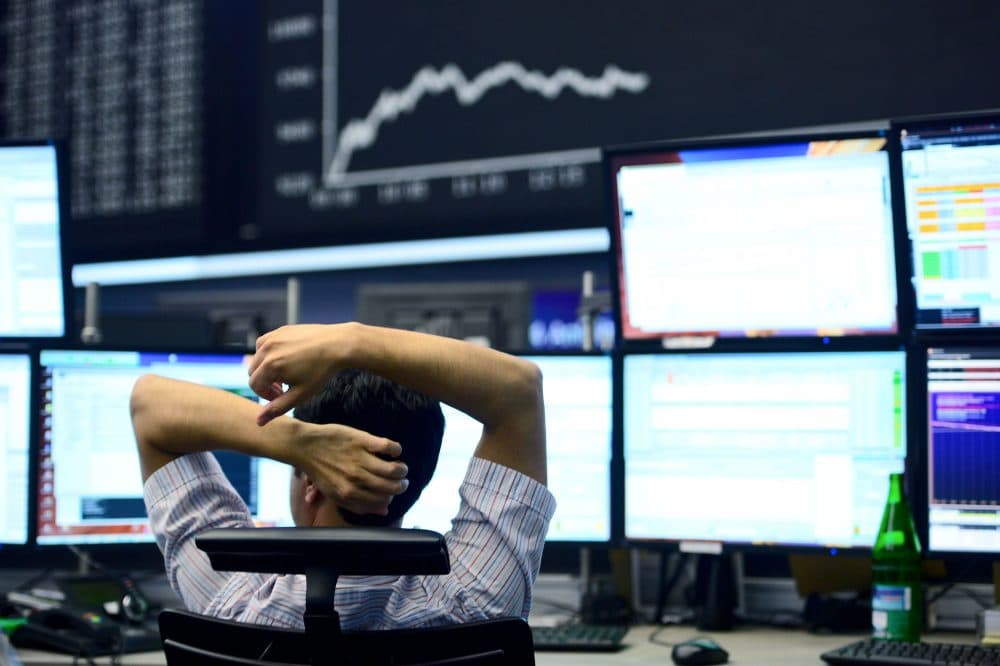 A trader sits at his desk under the day's performance board that shows a dive in the value of the DAX index of companies at the Frankfurt Stock exchange the day after a majority of the British public voted for leaving the European Union on June 24, 2016 in Frankfurt am Main, Germany. (Photo by Thomas Lohnes/Getty Images)