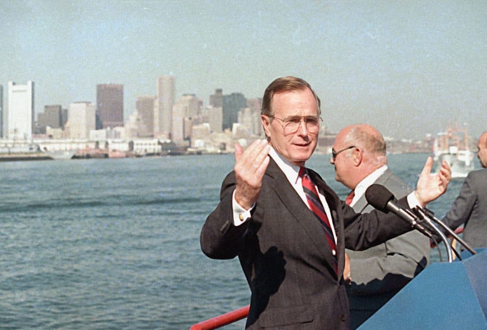 Vice President George H.W. Bush gestures while touring the Boston Harbor by boat, Sept. 1, 1988, during a brief campaign stop in Boston. Bush's campaign, which labeled Boston Harbor as "the dirtiest harbor in America" served as a catalyst for the clean up of the waters. (Peter Southwick/AP)
