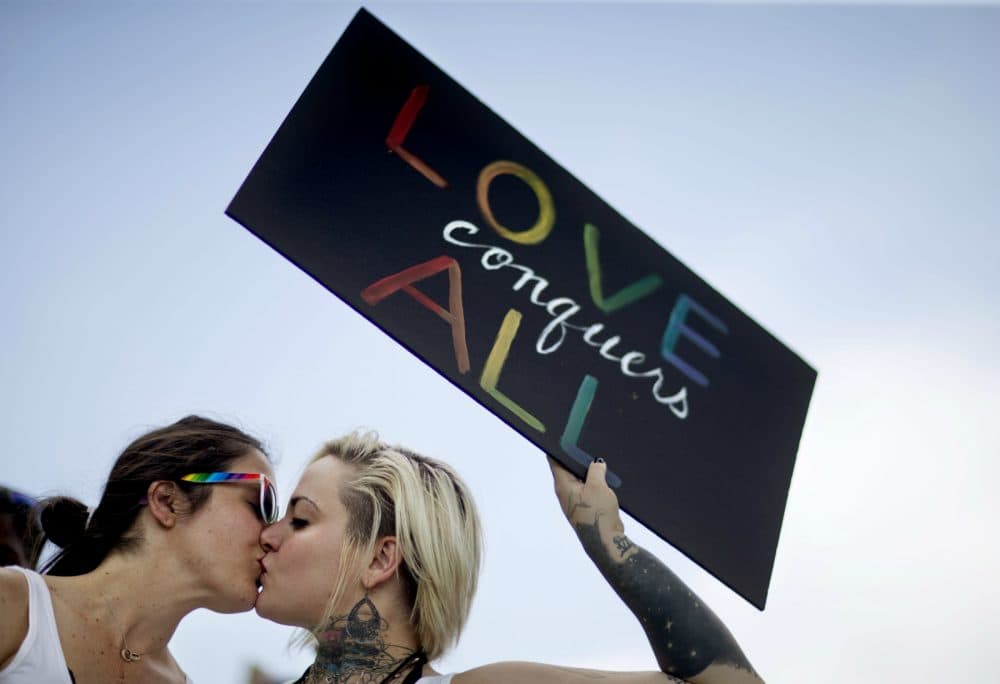 Kari Hong: The Pulse nightclub victims died in a space that was more sacred than what the word nightclub conveys. Pictured: Adriana Kelley, right, kisses Tiffany Findley, both of Orlando, as they stand with supporters outside the visitation for a Pulse nightclub shooting victim, Wednesday, June 15, 2016, in Orlando, Fla. (David Goldman/AP)