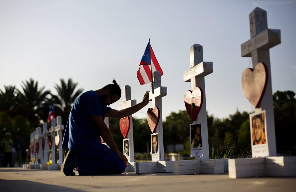 Ernesto Vergne prays at a memorial to those killed in the Pulse nightclub mass shooting in Orlando, Fla. (David Goldman/AP)