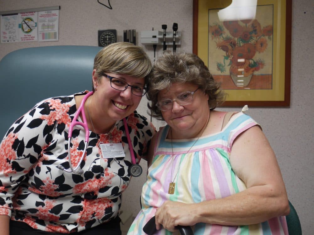 Dr. Heidi Gullett, left, poses with patient Molly Hileman at the Family Practice in Cleveland. (Alex Ashlock/Here & Now)