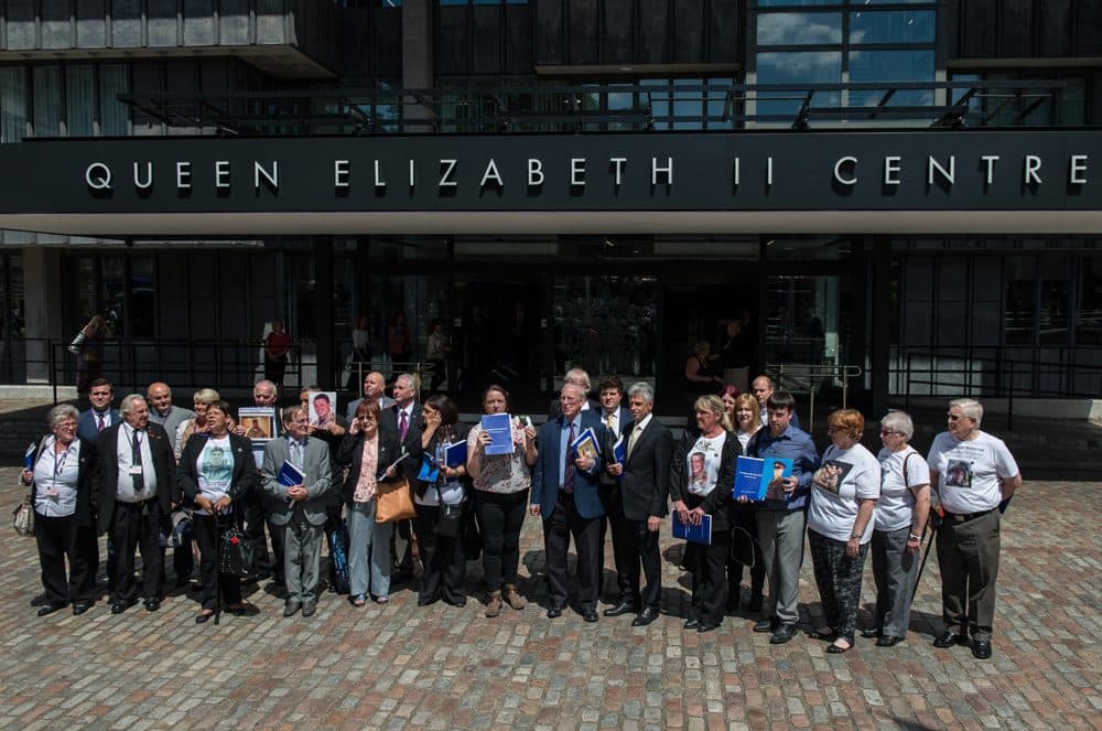 Families of soldiers killed in the Iraq conflict speak to the media outside the Queen Elizabeth II conference centre after the outcome of the Chilcot report on July 6, 2016 in London, England. The Iraq Inquiry Report into the UK government's involvement in the 2003 Iraq War under the leadership of Tony Blair is published today. The inquiry, which concluded in February 2011, was announced by then Prime Minister Gordon Brown in 2009 and is published more than seven years later. (Chris J Ratcliffe/Getty Images)