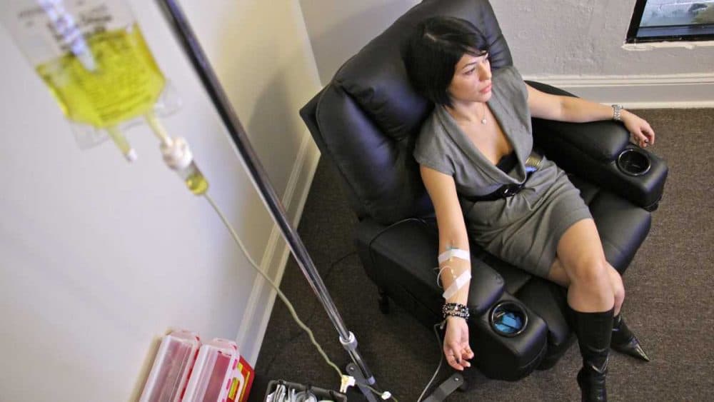 Yana Shapiro relaxes while taking a vitamin IV at RestoreIV in Philadelphia. (Courtesy of Emma Lee/WHYY)