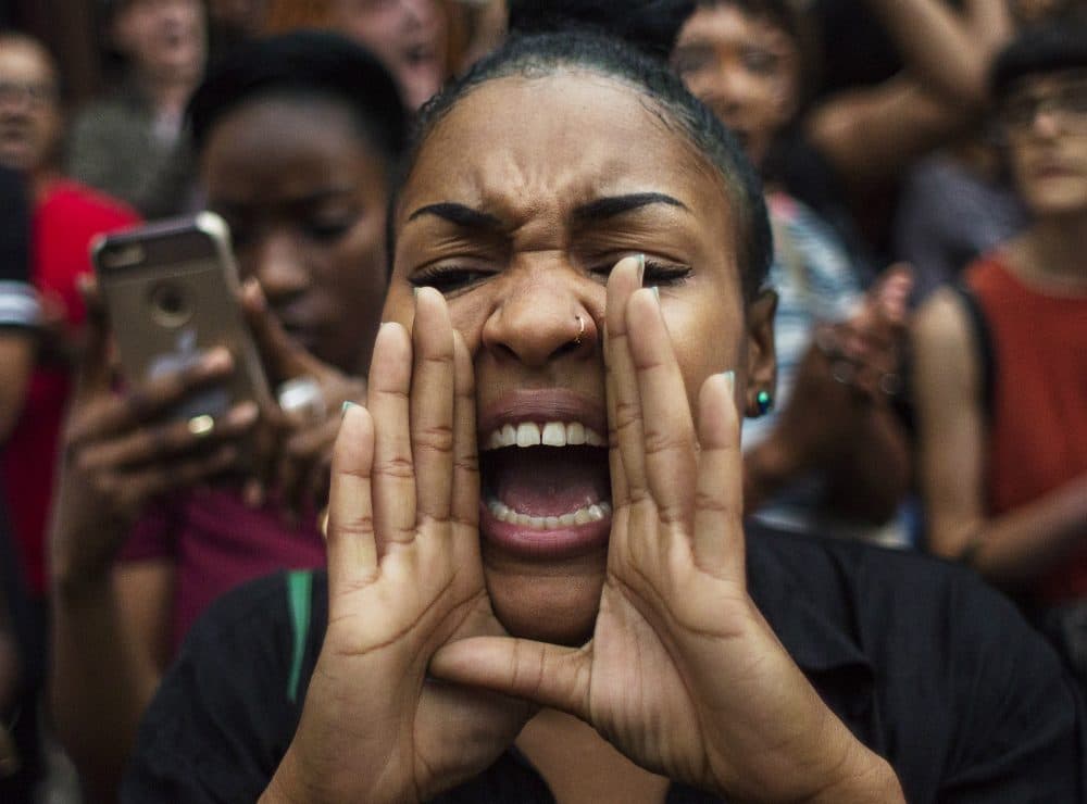 A protester shouts slogans in New York, Friday, July 8, 2016. Demonstrators took to the New York City streets chanted "hands up, don't shoot" and "no justice, no peace" to protest the recent police shootings in Louisiana and Minnesota, just one day after five police officers were killed and seven others wounded during a protest in Dallas. (Andres Kudacki/AP)