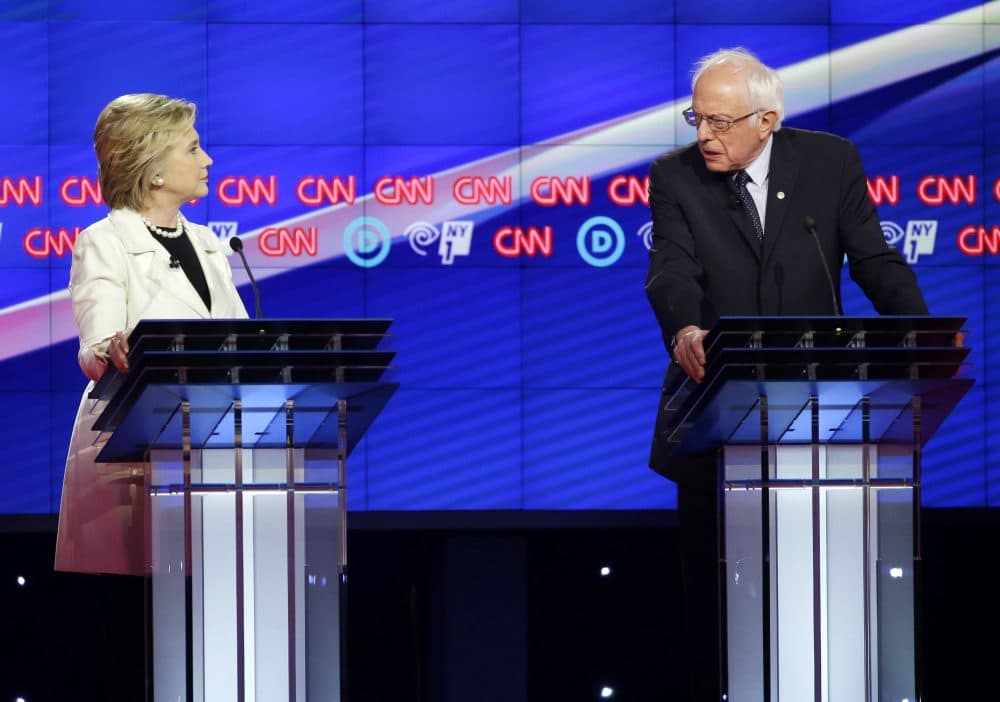 Democratic presidential candidates Sen. Bernie Sanders, I-Vt., right, and Hillary Clinton speak during the CNN Democratic Presidential Primary Debate at the Brooklyn Navy Yard in April in New York. (Seth Wenig/AP)