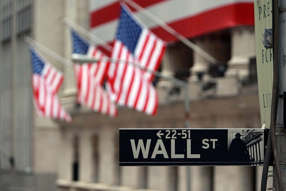 A Wall St. sign next to the New York Stock Exchange (NYSE) September 16, 2008 in New York City.
(Spencer Platt/Getty Images)