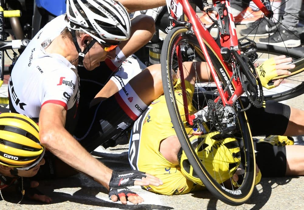 Tour De France Leader Hikes On Foot After Motorbike Crash Here Now