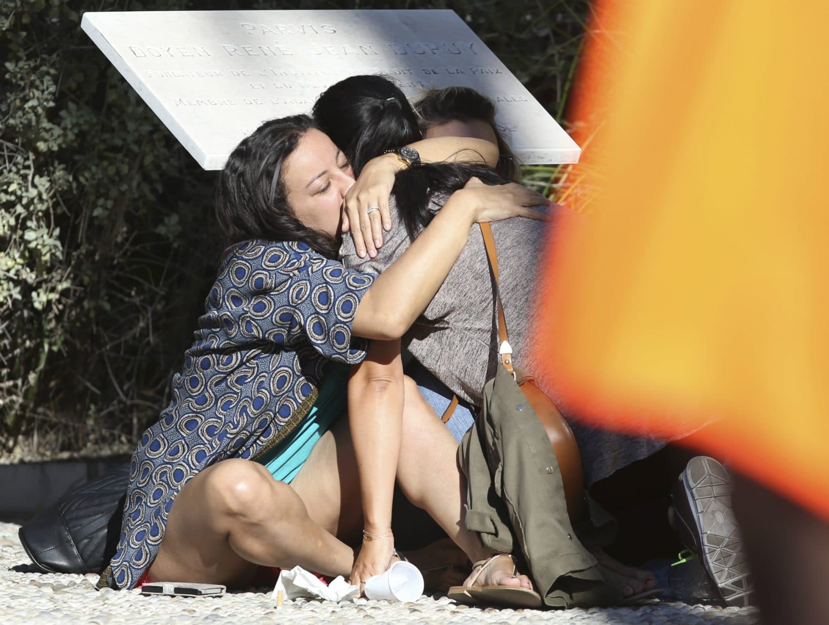 Parents of victims embrace each other near the scene of a truck attack in Nice, southern France, Friday, July 15, 2016. A large truck mowed through revelers gathered for Bastille Day fireworks in Nice, killing more than 80 people and sending people fleeing into the sea as it bore down for more than a mile along the Riviera city's famed waterfront promenade. (Luca Bruno/AP)