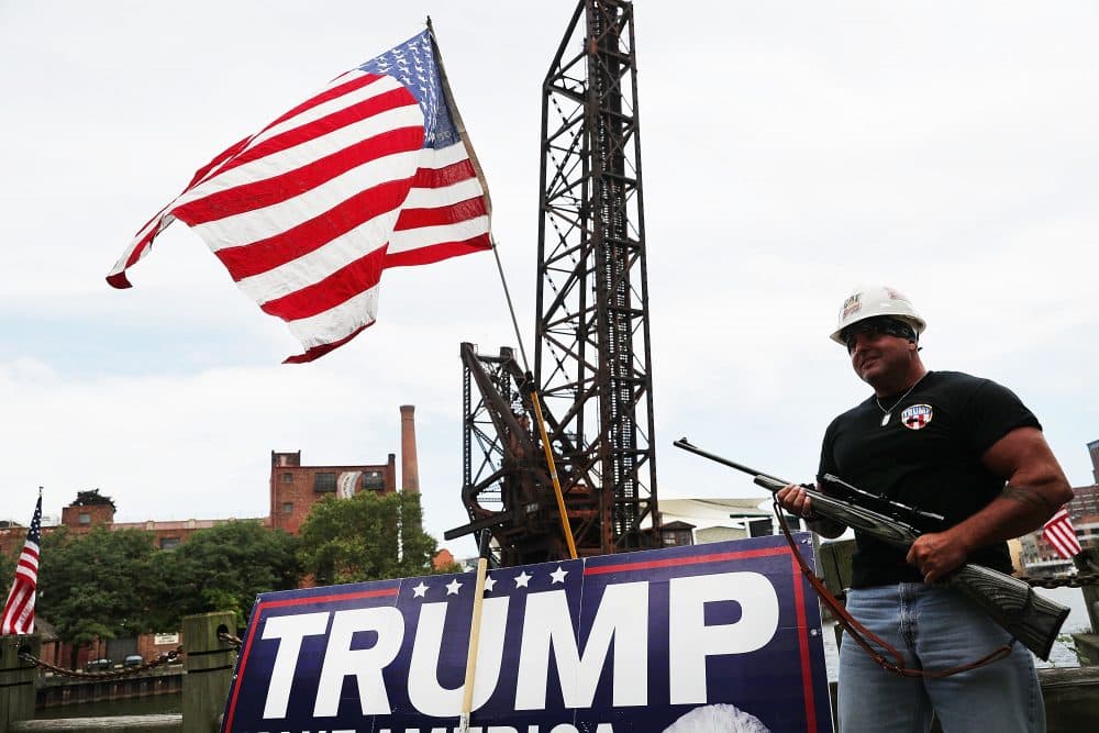 A Donald Trump supporter poses with a gun while attending a rally for Trump on the first day of the Republican National Convention (RNC) on July 18, 2016 in downtown Cleveland, Ohio. An estimated 50,000 people are expected in downtown Cleveland, including hundreds of protesters and members of the media. The convention runs through July 21. (Spencer Platt/Getty Images)