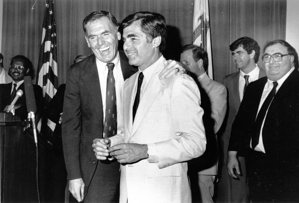 Former Boston Mayor Ray Flynn (left) puts his hand on former Massachusetts Gov. Michael Dukakis in this file photo from the 1980s. Dukakis was the Democratic nominee for president in 1988. (City of Boston Archives/Flickr)